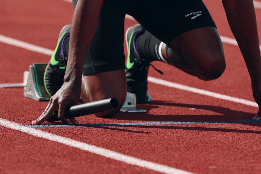 Athlete on track ready to run showing precise metabolic energy expenditure